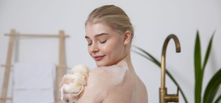 close-up-smiley-woman-holding-bath-sponge